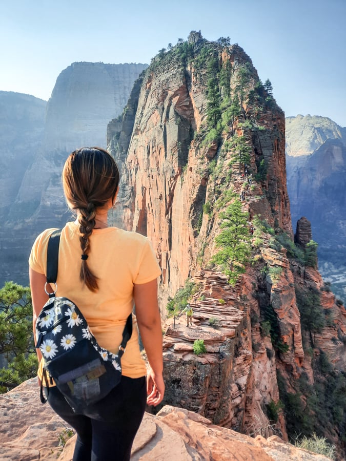 Woman hiker looking at Angels Landing in Zion National Park Utah