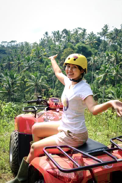 Girl riding an ATV at the jungle in Ubud