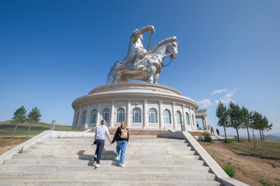 Visitors walking up the steps at the Genghis Khan statue complex in Mongolia