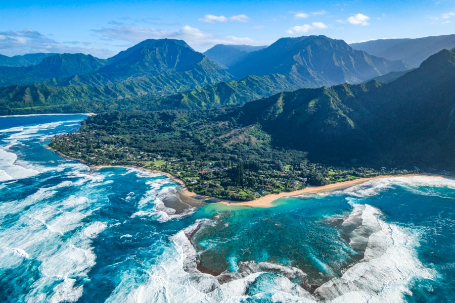 Doors off helicopter view of Tunnels Beach in Kauai Hawaii