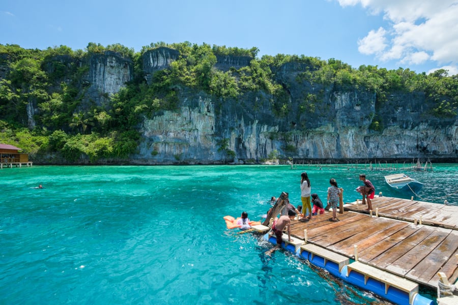 Local kids jumping into the water at the Karamba resto