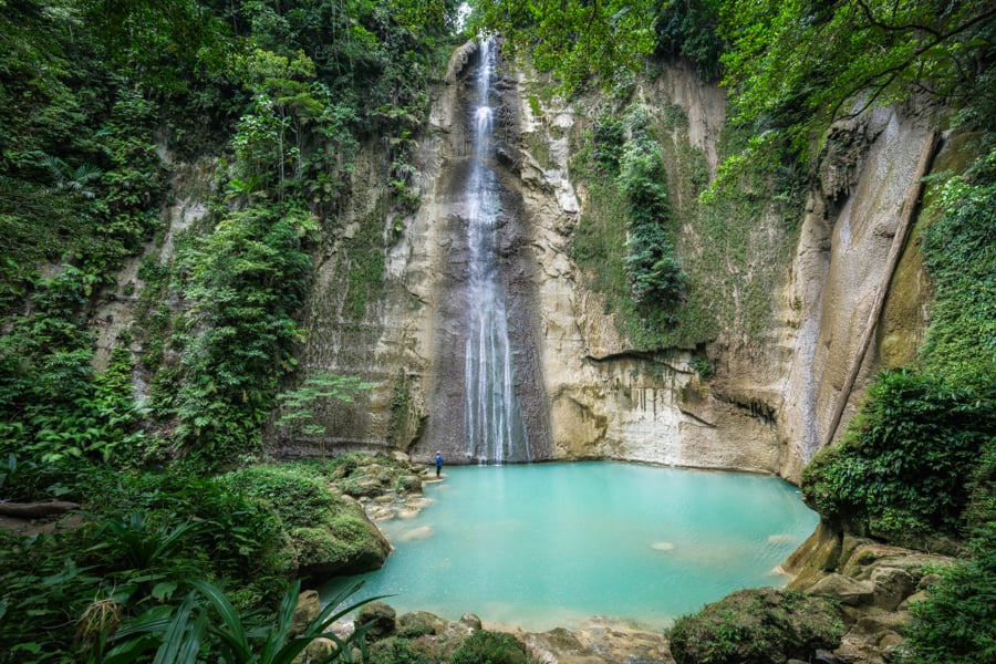 Samparona waterfall and turquoise pool in the jungle of Buton Sulawesi